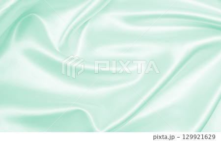 Smooth elegant green silk or satin luxury cloth texture as abstract background. Luxurious background design Smooth elegant green silk or satin luxury cloth texture as abstract background. Luxurious background design 129921629