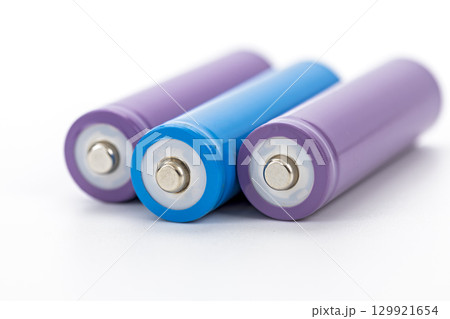 Purple and blue cylindrical rechargeable batteries arranged on white background close up clean modern energy storage technology power supply minimalistic vibrant color Purple and blue cylindrical rechargeable batteries arranged on white background close up clean modern energy storage technology power supply minimalistic vibrant color 129921654