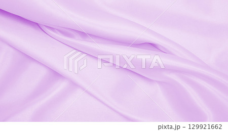 Smooth elegant lilac silk or satin texture as wedding background. Luxurious background design 129921662