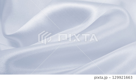 Smooth elegant grey silk or satin luxury cloth as wedding background. Luxurious background design 129921663