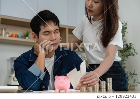 Couple Facing Financial Challenges. Young adults discussing budget with concern. Couple Facing Financial Challenges. Young adults discussing budget with concern. 129922433