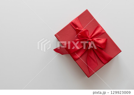 Red Christmas gift box on a white background. Red Christmas gift box on a white background. 129923009