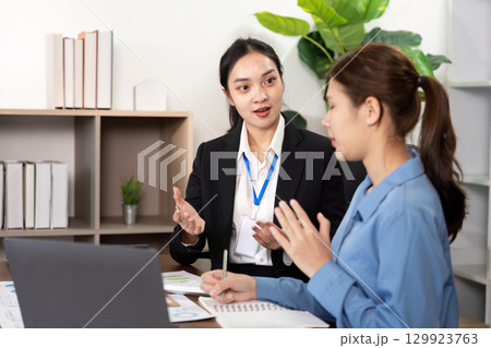 Client and Financial Advisor Analyzing Data Together Client and Financial Advisor Analyzing Data Together 129923763