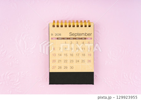 Desk calendar for September 2026 on flower pattern embossed as background. Desk calendar for September 2026 on flower pattern embossed as background. 129923955