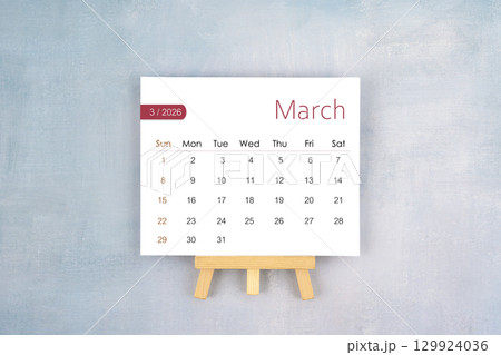March 2026 calendar page with wooden easel, Flat lay. March 2026 calendar page with wooden easel, Flat lay. 129924036