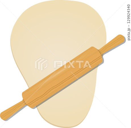 Wooden rolling pin rests diagonally atop a light beige blob of dough against black backdrop. 129924340