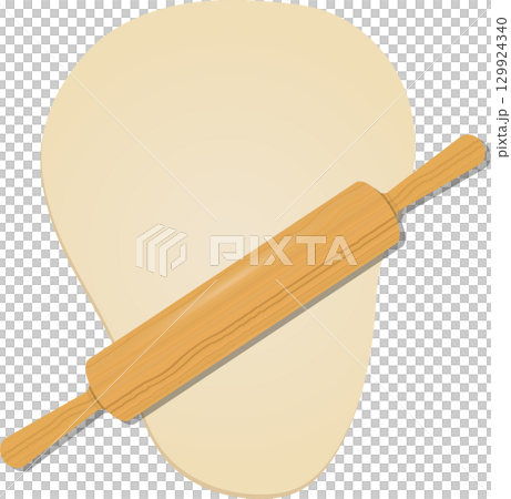 Wooden rolling pin rests diagonally atop a light beige blob of dough against black backdrop. 129924340