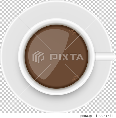 Overhead shot of a white cup and saucer filled with a rich brown drink with small bubbles. 129924711