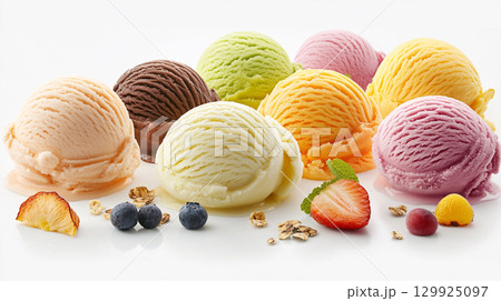 A colorful assortment of various ice cream scoops is artfully arranged on a white background.  129925097