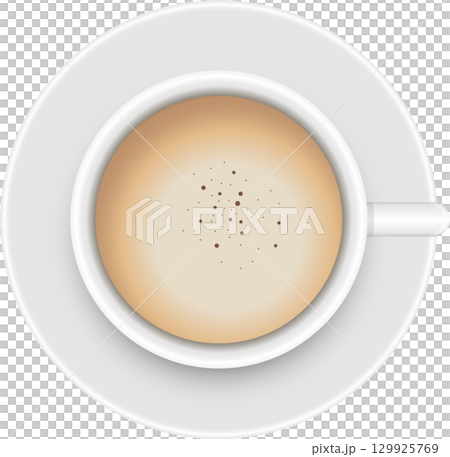 Overhead view of a cup filled with a creamy beverage and topped with light brown speckles. 129925769