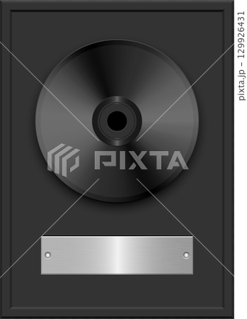 A framed black record on a dark background, with a metallic silver nameplate on the frame. 129926431
