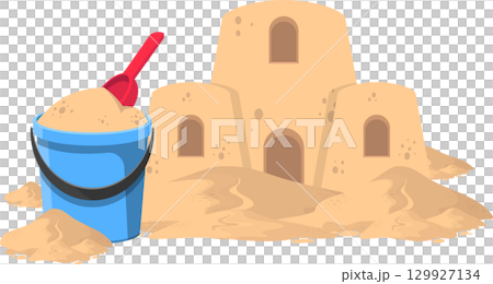 Sandcastle fantasy: A bucket, shovel, and finished sandcastle on a sandy beach vacation. 129927134
