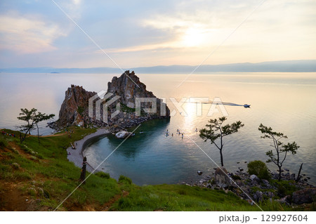 Lake Baikal, Shamanka Rock or Cape Burkhan at sunset. 129927604