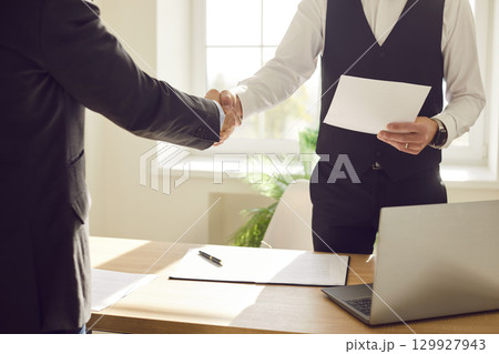 Business people handshake in good greeting, showing agreement, contract, deal after negotiation Business people handshake in good greeting, showing agreement, contract, deal after negotiation 129927943