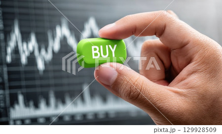 Hand pressing buy button with stock trading chart Hand pressing buy button with stock trading chart 129928509