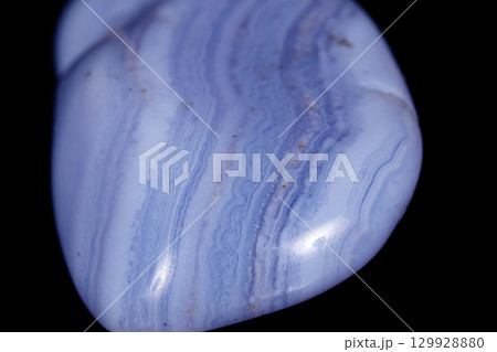 Macro mineral blue agate sapphirin in the rock on black background 129928880