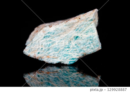 Macro mineral stone Amazonite on black background 129928887