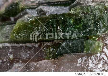 Macro mineral tourmaline stone in quartz on a white background 129928918