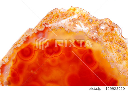 Macro mineral orange agate in crystals on white background 129928920