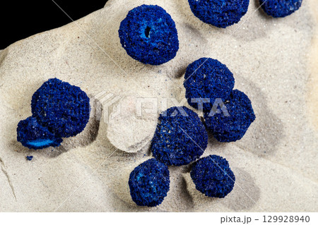 Macro mineral stone Azurite in siltstone against black background Macro mineral stone Azurite in siltstone against black background 129928940