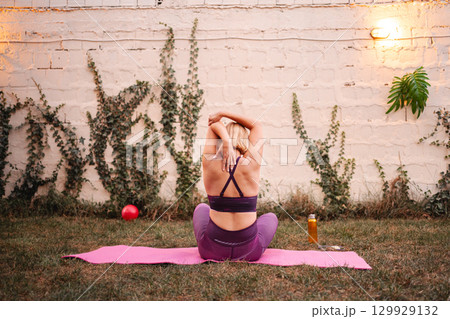 New mother exercises outdoors to enhance her wellness and self-care 129929132