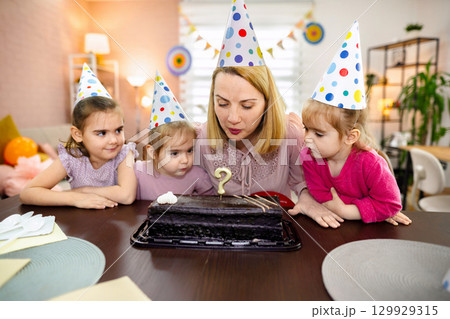 Birthday celebration brings joy to children at a cozy home party Birthday celebration brings joy to children at a cozy home party 129929315