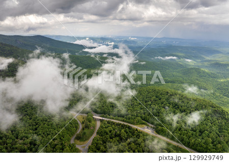 Mountain pass road in North Carolina Appalachian mountains, USA. Beacon Heights parking lot overlook on Blue Ridge Parkway in summer season Mountain pass road in North Carolina Appalachian mountains, USA. Beacon Heights parking lot overlook on Blue Ridge Parkway in summer season 129929749