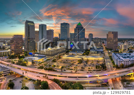 Downtown district of Tampa city in Florida, USA after sunset. Brightly illuminated highway and high buildings in modern American urban area. 129929781