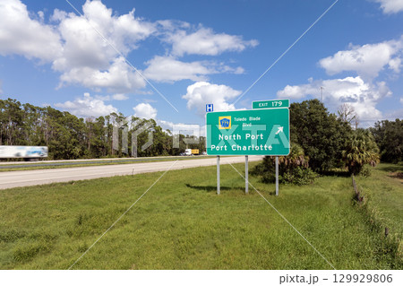 Interstate freeway exit sign in Florida, USA. I-75 highway interchange with direction to North Port and Port Charlotte 129929806