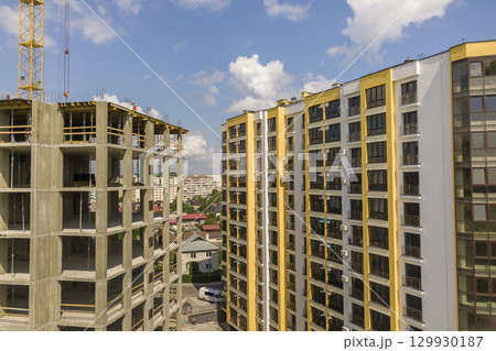 Apartment or office tall concrete building under construction. Apartment or office tall concrete building under construction. 129930187