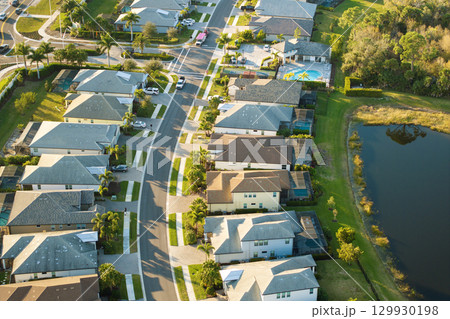 Wealthy residential area in USA suburbs. Rich neighborhood with expensive suburban homes in southwest Florida 129930198