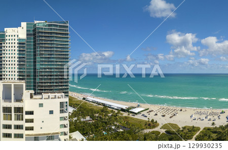 View from above of american southern seashore of Miami Beach city. South Beach high luxurious hotels and apartment buildings. Tourist infrastructure in southern Florida, USA 129930235