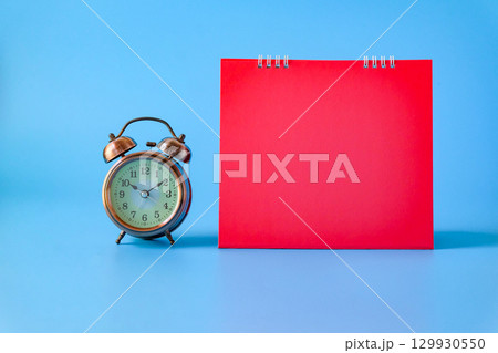 Alarm clock with bank red calender.back to school concepts. 129930550