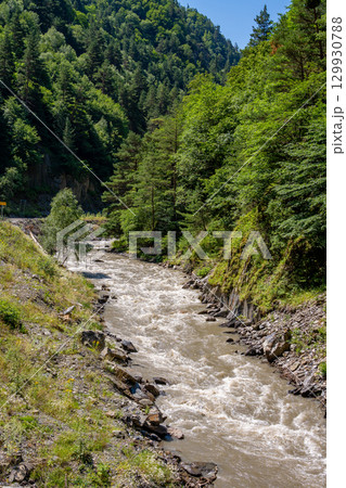 The beautiful valley of a mountain river in Khevsureti, Georgia. 129930788