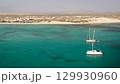 Aerial view of the luxury yacht moored in turquoise ocean background the desert 129930960