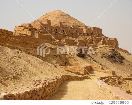 Ksar Guermessa located under the peak of Ras Oum Moutmana, Tunisia 129930990