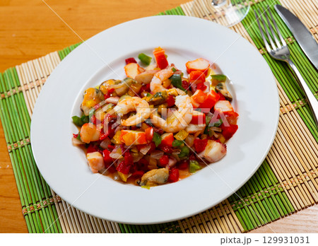 Bright Salpicon de Marisco, combining seafood and fresh vegetables 129931031