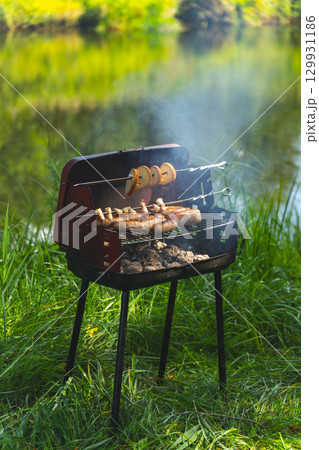 Mobile barbecue on the forest river bank. 129931186