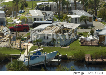View from abover of damaged mobile homes after hurricane Ian in Florida residential area. Consequences of natural disaster View from abover of damaged mobile homes after hurricane Ian in Florida residential area. Consequences of natural disaster 129931301