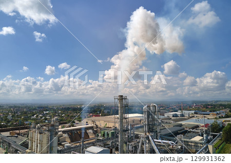 Aerial view of factory with high plant manufacture structure. Global production and manufacturing concept. Aerial view of factory with high plant manufacture structure. Global production and manufacturing concept. 129931362