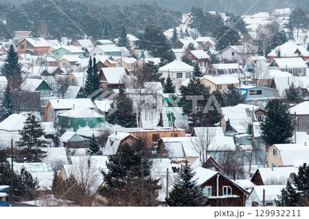 Nestled in a quiet area, the village is draped in soft white snow, transforming each house into a picturesque winter 129932211