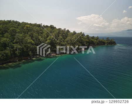 pine headland and emerald shallows along gokova bay coastline, mugla, Turkey 129932726