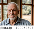 Warm Portrait of a Senior Man with Natural Light 129932895