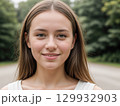 Smiling Young Woman in Nature 129932903