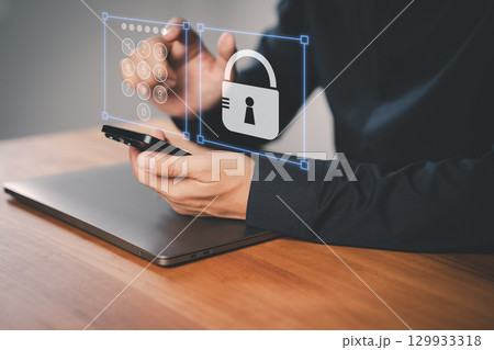 Adult man using a smartphone with a security keypad and padlock icon, symbolizing data protection, privacy, digital security, and secure mobile authentication for modern cybersecurity systems. 129933318