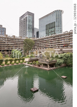 The Barbican Centre in London is renowned for its unique integration of multi-level water gardens and greenery within its Brutalist architectural design. The Barbican Centre in London is renowned for its unique integration of multi-level water gardens and greenery within its Brutalist architectural design. 129934868