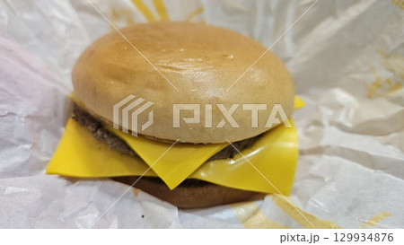 This is a double cheeseburger. 129934876