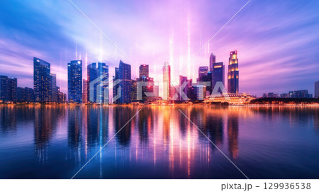 Majestic city skyline at dusk, illuminated skyscrapers reflecting on water, creating vibrant atmosphere Majestic city skyline at dusk, illuminated skyscrapers reflecting on water, creating vibrant atmosphere 129936538