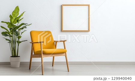 Cozy Yellow Chair with Plant and Blank Frame Against Minimalist White Wall Decor 129940040