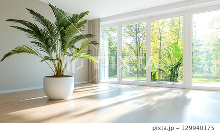 Bright and Airy Living Room with Large Potted Plant and Sunlight Streaming Through Windows 129940175